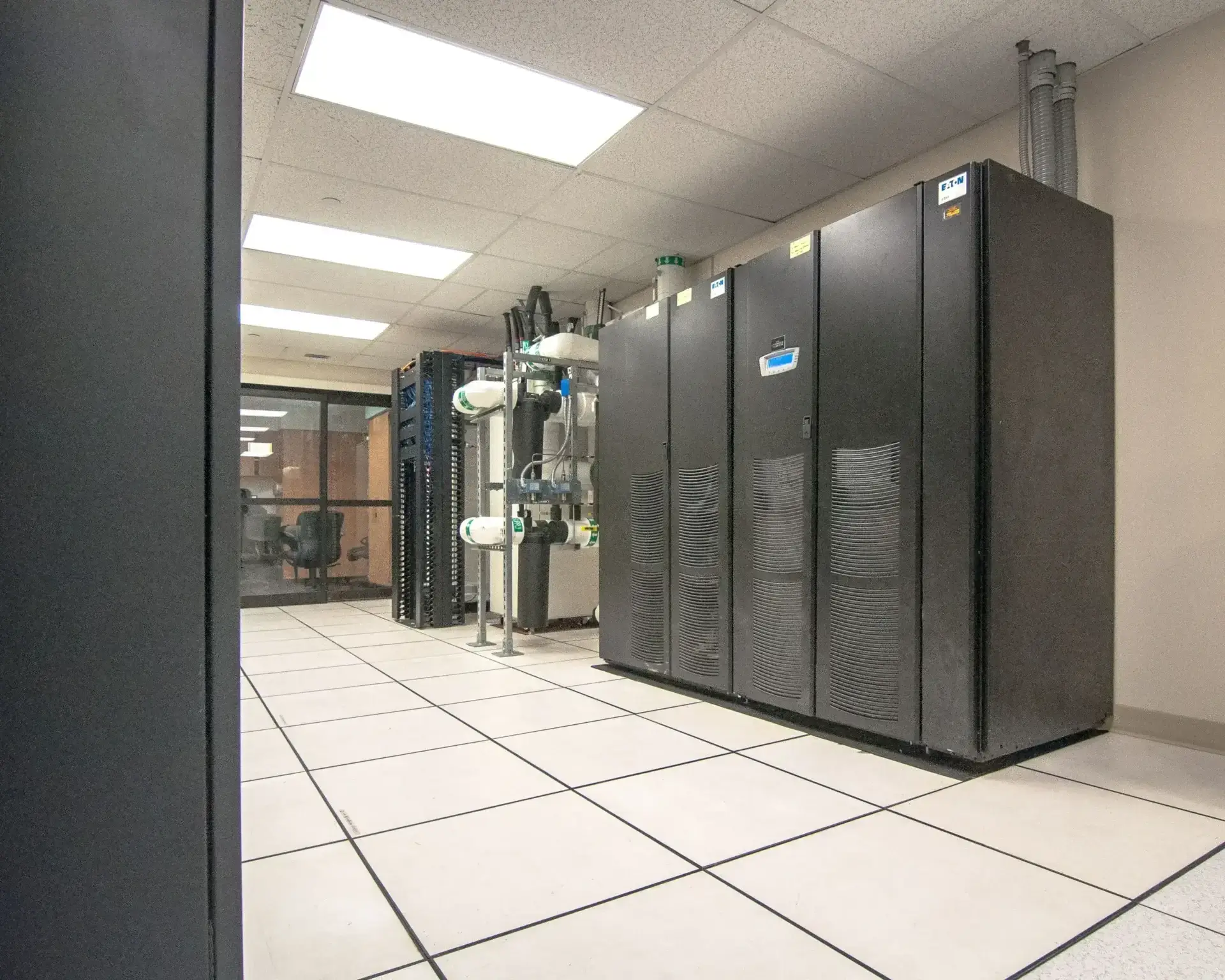Server room with large black cabinets.