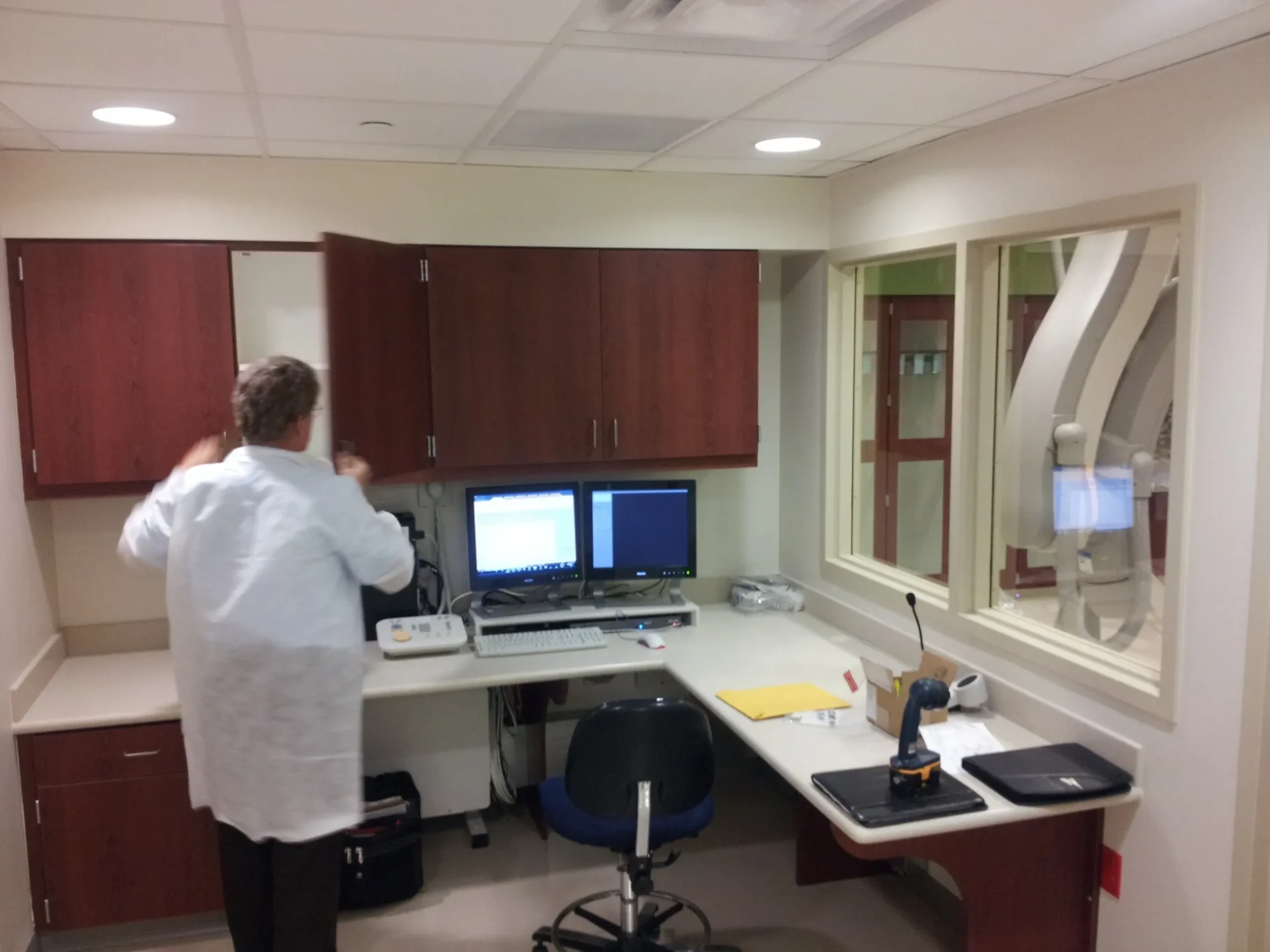 Hospital lab with computers and equipment.